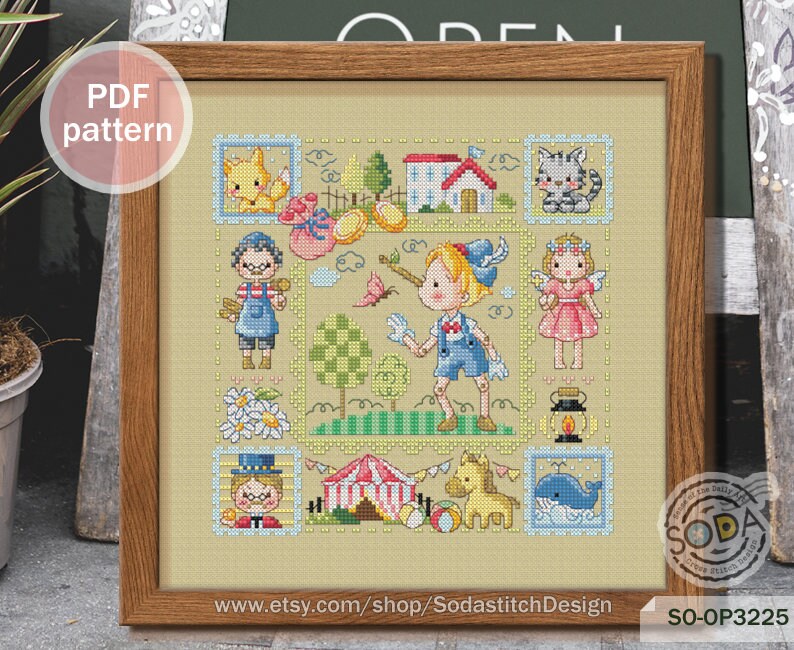 May include: A colorful cross-stitch pattern featuring a whimsical scene with a boy, a girl, a cat, a fox, a house, a tent, and a whale. The pattern is framed in a wooden frame and includes the text "SO-OP3225" and "www.etsy.com/shop/SodastitchDesign".