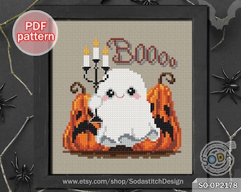 May include: A cross stitch pattern featuring a cute ghost with a pumpkin and candles. The pattern includes the text "Boo".