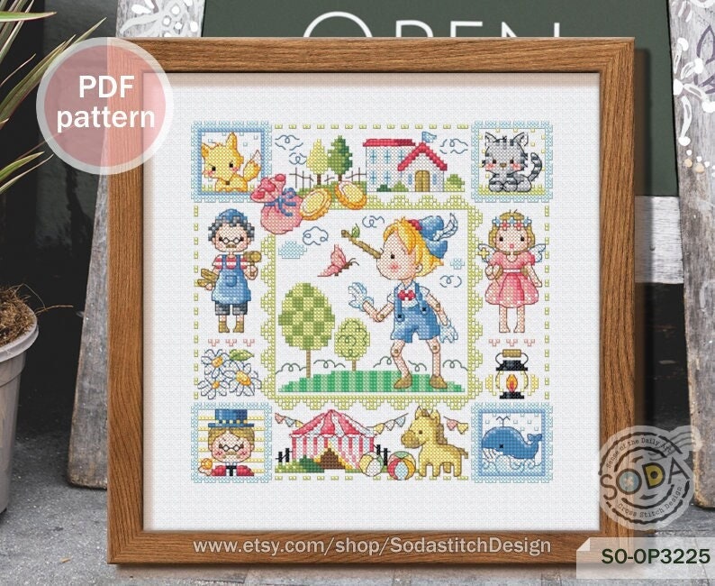 May include: A colorful cross-stitch pattern featuring a whimsical scene with a boy with a long nose, a girl with wings, a house, a cat, a fox, a tent, a horse, and a whale. The pattern is framed in a wooden frame and includes the text "SO-OP3225" and "www.etsy.com/shop/SodastitchDesign".