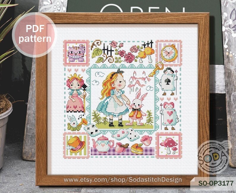 May include: A framed cross-stitch pattern featuring Alice in Wonderland characters. The pattern includes Alice, the White Rabbit, the Queen of Hearts, and the Cheshire Cat. The pattern is in a colorful, whimsical style.