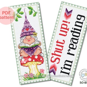 May include: Two cross stitch bookmark patterns. The first pattern features a gnome sitting on a mushroom reading a book. The second pattern features the text "Shut up! I'm reading".