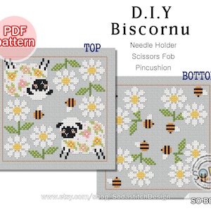 May include: A PDF pattern for a DIY biscornu, a small, round, stuffed cushion. The pattern features a design of daisies and bees. The text "D.I.Y Biscornu" is at the top of the image. The text "TOP" and "BOTTOM" are at the top and bottom of the two pattern sections. The text "Needle Holder, Scissors Fob, Pincushion" is below the title. The text "SO-BC105" and "www.etsy.com/shop/SodastitchDesign" are at the bottom of the image.