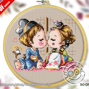 May include: Cross stitch pattern of a couple in traditional Korean clothing kissing. The man is wearing a blue and white outfit, and the woman is wearing a pink and yellow outfit. The pattern is on a beige background with a heart and a candle.