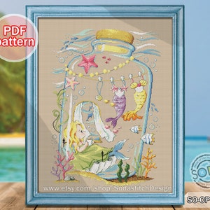 May include: Cross stitch pattern of a mermaid in a glass bottle with other mermaids hanging from the top. The bottle is surrounded by seaweed and bubbles. The pattern is available as a PDF download. The text "www.etsy.com/shop/SodastitchDesign" is at the bottom of the image. The text "SO-OPG199" is in the bottom right corner.