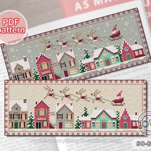 May include: Cross stitch bookmark pattern featuring a winter village scene with houses, snow, and reindeer pulling a sleigh. The pattern is available as a PDF download. The text "SO-BM66" is in the bottom right corner of the image.