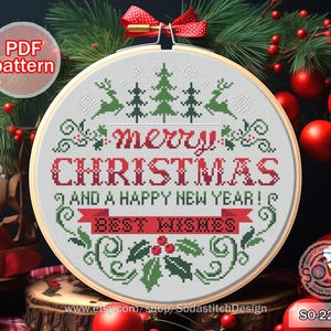 Może przedstawiać: Biały wzór do haftu krzyżykowego z czerwono-zielonym motywem świątecznym. Wzór zawiera tekst "merry CHRISTMAS and a happy new year! BEST WISHES".