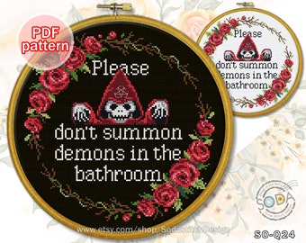 May include: A black and white cross stitch pattern with a red hooded figure and the text "Please don't summon demons in the bathroom". The pattern is surrounded by red roses.