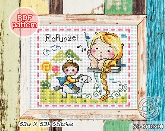 以下が含まれることがあります： ラプンツェルと馬に乗った王子を描いたクロスステッチパターン。パターンは幅63ステッチ、高さ53ステッチ。パターンはピンクと黄色の縁取りのある白いフレームに入っています。