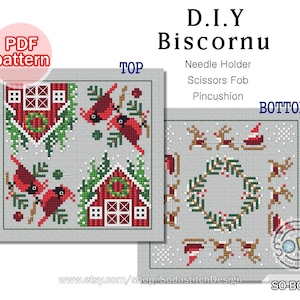 May include: A PDF pattern for a DIY biscornu, a small, round, stuffed cushion. The pattern features a winter scene with cardinals, a house, and a wreath. The pattern is titled "D.I.Y Biscornu" and includes instructions for making a needle holder, scissors fob, or pincushion.