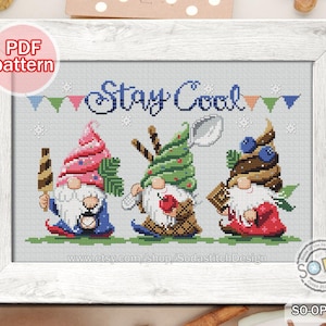 May include: Cross-stitch pattern showing three gnomes with ice cream cone hats, holding treats, and the words "Stay Cool." The gnomes are in a white wooden frame. The pattern is a PDF download.