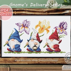 May include: A cross-stitch pattern featuring three gnomes carrying flowers. The gnomes are wearing red, blue, and white hats and have white beards. The flowers are yellow, purple, and white. The pattern is titled "Gnome's Delivery Series" and includes the text "PDF pattern".