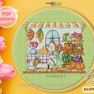 May include: A cross-stitch pattern of a girl in a green dress standing in front of a market stall with a variety of fruits and vegetables. The stall has a sign that says "MARKET".