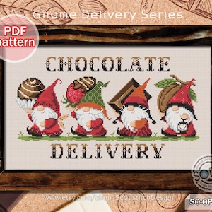May include: Cross stitch pattern featuring four gnomes carrying chocolate, with the text "Chocolate Delivery" above them. The pattern is in a wooden frame and labeled "PDF pattern".