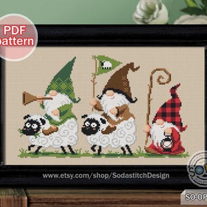 May include: Cross stitch pattern featuring three gnomes riding sheep. The gnomes are wearing green, brown, and red and black checked hats. The sheep are white with black faces. The pattern includes the text "SO-OP2221".