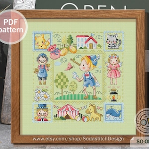 May include: A colorful cross-stitch pattern featuring a whimsical scene with children, animals, and a circus tent. The pattern is framed in a wooden frame and includes the text "SO-OP3225" and "www.etsy.com/shop/SodastitchDesign".