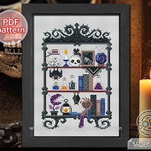 May include: Cross stitch pattern featuring a black and white illustration of a spooky apothecary shelf with potion bottles, skulls, and a spider. The text "www.etsy.com/shop/SodastitchDesign" is at the bottom of the image.