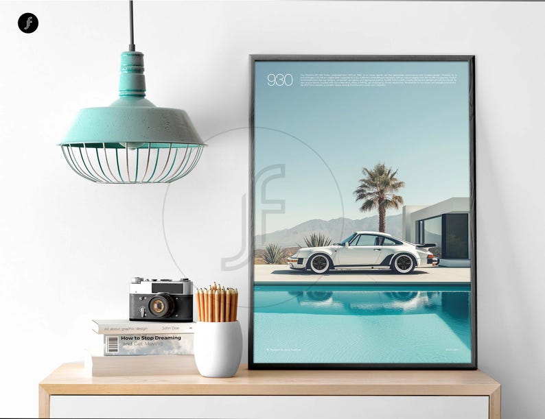 May include: A framed poster with a white Porsche 930 driving by a pool in a desert landscape. The poster is titled "930" and has a blue sky and white clouds in the background.