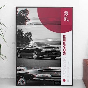 May include: Black and white poster featuring a Toyota Soarer. The poster has a red and white color scheme with Japanese text and a graphic of the car. The poster is framed in black.