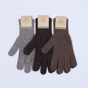 May include: Three pairs of yak wool gloves in gray, brown, and dark brown. Each pair has a tag that reads "Handcrafted Yak Wool".