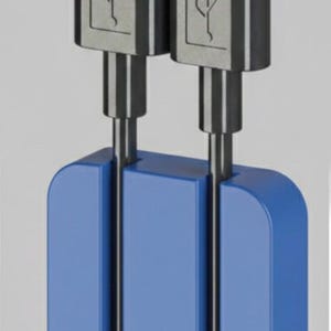 May include: Two USB-C charging cables with silver connectors and a blue cable organizer. The connectors have a USB symbol. The cables are held together by a blue, rectangular holder.