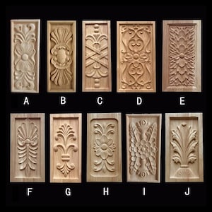 May include: Ten rectangular wooden carvings with various floral and geometric designs. Each carving is framed and features detailed relief work. The carvings are labeled A through J, showcasing a range of decorative styles.
