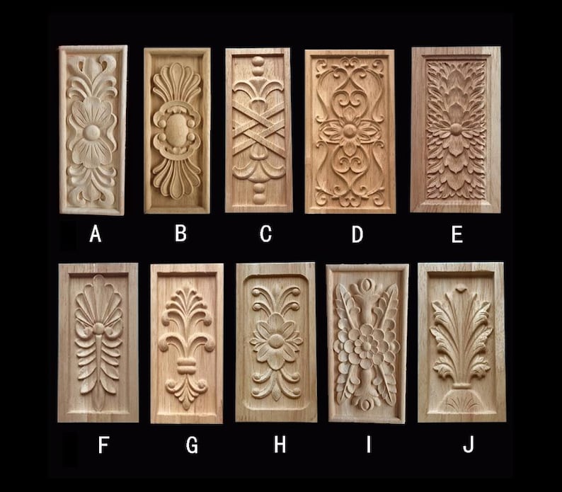 May include: Ten rectangular wooden carvings with various floral and geometric designs. Each carving is framed and features detailed relief work. The carvings are labeled A through J, showcasing a range of decorative styles.