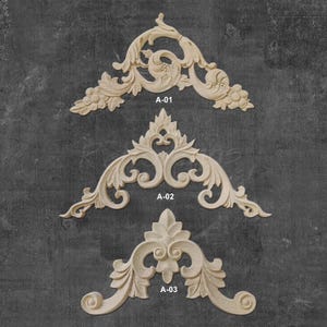 May include: Three wooden decorative corner brackets with intricate floral designs. The brackets are labeled A-01, A-02, and A-03.