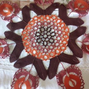 round centered crocheted stylized flowers image 1