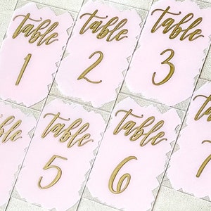 4 x 6“ Acrylic Wedding table numbers with blush pink painted background and gold calligraphy