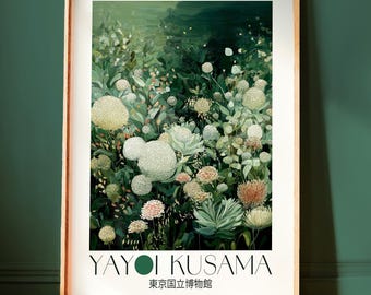 May include: A framed art print featuring a lush, green floral scene with white, pink, and green blooms. The print includes the text "YAYOI KUSAMA" and Japanese text, set against a white background within a wooden frame.