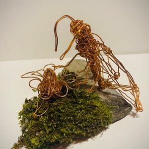 Pollinating moth copper wire art on moss slate plinth