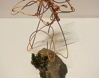 Butterfly copper wire art sculpture mounted on moss slate