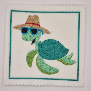 May include: Embroidered square patch depicting a cartoon sea turtle wearing a straw hat and blue sunglasses. The turtle is green with a teal shell, smiling, and set against a white background with a teal border. The patch has a scalloped edge.