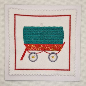 Tarjeta de caravana gitana bordada