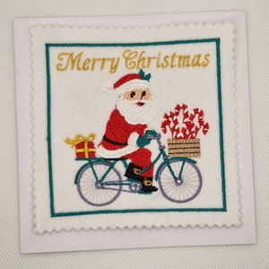 Carte brodée Père Noël à vélo