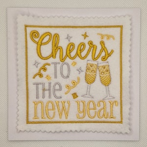Tarjeta de año nuevo con saludos bordados