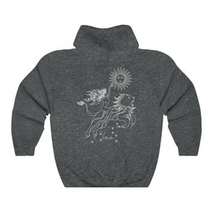 May include: A dark gray hooded sweatshirt with a white graphic of the Leo zodiac sign. The graphic features a woman riding a lion with a sun above them. The text "Leo" is below the graphic.