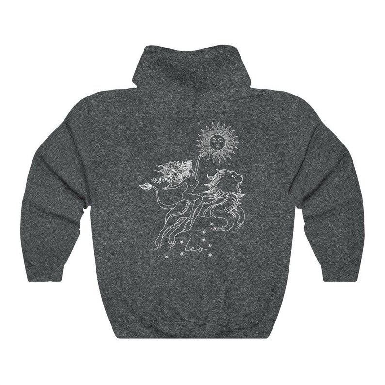 May include: A dark gray hooded sweatshirt with a white graphic of the Leo zodiac sign. The graphic features a woman riding a lion with a sun above them. The text "Leo" is below the graphic.