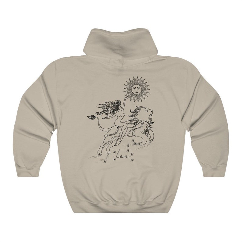 May include: A tan hoodie with a black and white illustration of a woman riding a lion with a sun above them. The text "Leo" is below the illustration.