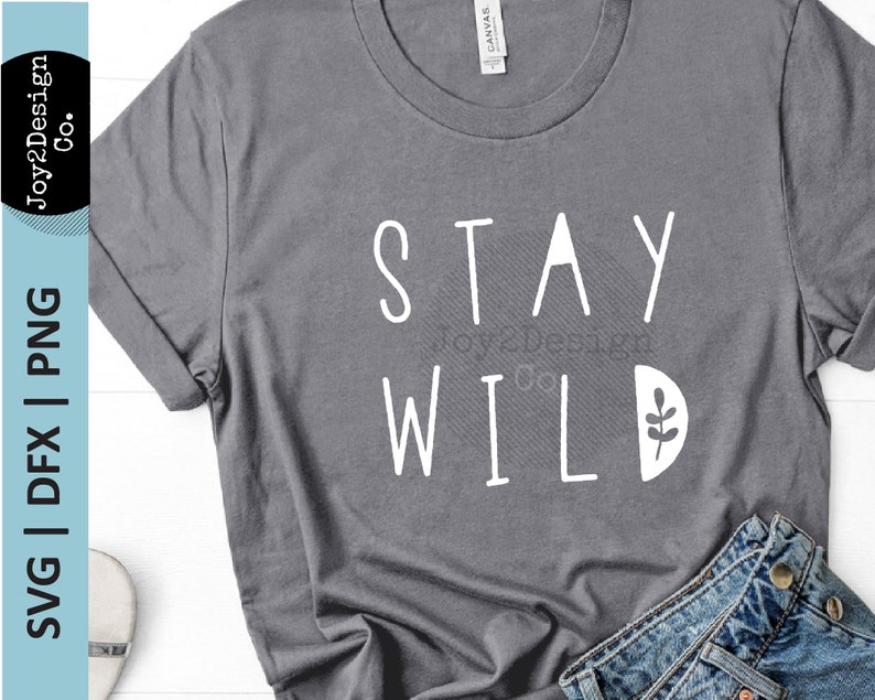 May include: A gray t-shirt with the text "STAY WILD" in white lettering. A small white leaf design is next to the word "WILD".