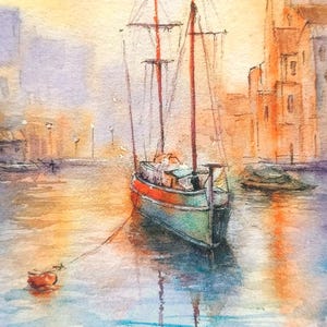 May include: Watercolor painting of a sailboat in a harbor. The boat has red masts and a green and red hull. The water reflects the boat and the buildings in the background. The sky is a mix of orange and yellow.