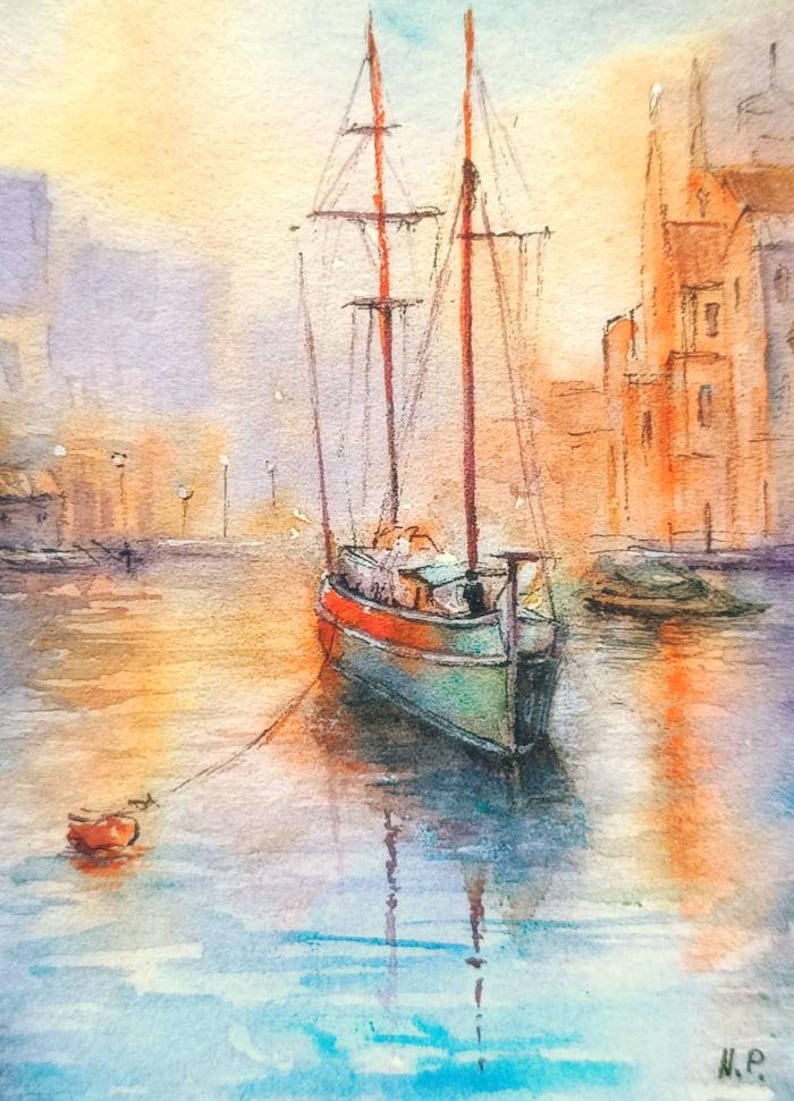 May include: Watercolor painting of a sailboat in a harbor. The boat has red masts and a green and red hull. The water reflects the boat and the buildings in the background. The sky is a mix of orange and yellow.
