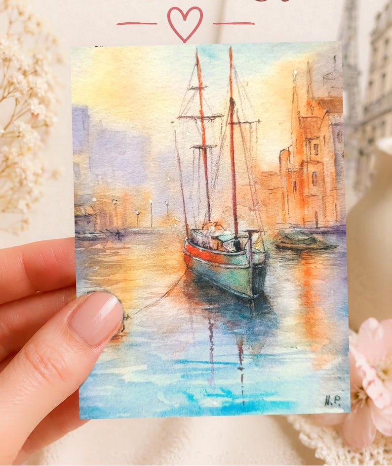 May include: Watercolor painting of a sailboat in a harbor. The boat has a red and green hull, with masts and rigging. The water reflects the warm colors of the sunset and the buildings in the background. The painting is signed "N.P."