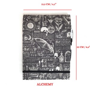 May include: A black and white notebook with a vintage alchemy design. The notebook measures 6.1 inches by 8.6 inches and has a black elastic band closure. The cover features a variety of illustrations, including a skull, a bat, a sun, a key, and a bottle. The text "ALCHEMY" is printed in red at the bottom of the notebook.