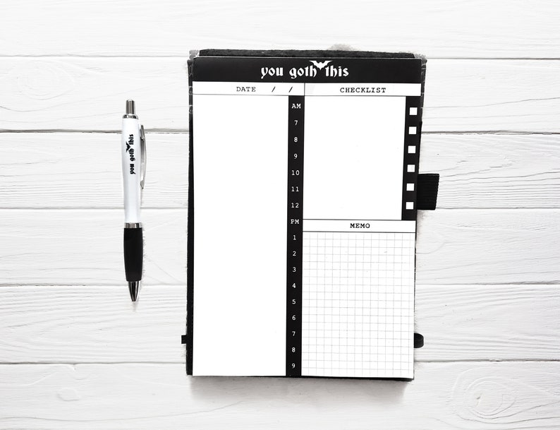 May include: A black and white daily planner with the text "you goth this" on the cover. The planner has a checklist and memo section.
