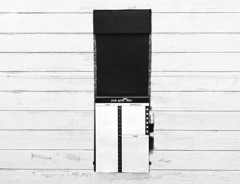May include: Black leather notepad with a checklist and memo section. The notepad has the text "you got this" printed on the front.