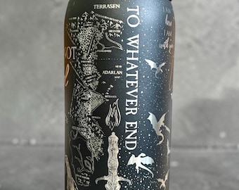 May include: A black Owala water bottle featuring a detailed map illustration, a sword graphic, and the text TO WHATEVER END. The design includes small dragon silhouettes, mountain ranges, and additional text elements printed in a light color.