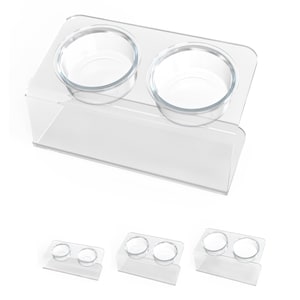 May include: A clear acrylic pet food and water bowl stand with two bowls. The stand is designed to elevate the bowls off the ground, making it easier for pets to eat and drink.