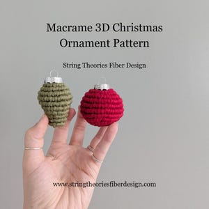 May include: Two macrame Christmas ornaments, one olive green and one red, with silver-colored metal caps. The text reads "Macrame 3D Christmas Ornament Pattern" and "String Theories Fiber Design". The website address is also visible.