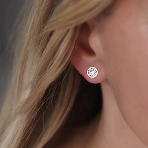 Sterling silver stud earrings are the epitome of sophistication with their intricate geometric pattern.